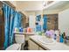 Standard bathroom with tile floors, a bath tub, and white sink at 107 Talavera Ln, Kissimmee, FL 34758