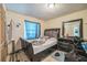 Bedroom featuring neutral walls, tile flooring, and a large dresser at 107 Talavera Ln, Kissimmee, FL 34758