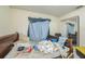 Bedroom with tile floors and a double bed, with attached bathroom at 107 Talavera Ln, Kissimmee, FL 34758
