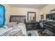 Bedroom featuring neutral walls, tile flooring, and a large dresser at 107 Talavera Ln, Kissimmee, FL 34758
