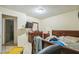 Bedroom with tile floors and a double bed, with attached bathroom at 107 Talavera Ln, Kissimmee, FL 34758