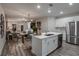 Open-concept kitchen with stainless steel appliances and living area view at 3763 King Hill Dr, Haines City, FL 33844