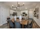 Kitchen area with island, dining table, and stainless steel appliances at 3763 King Hill Dr, Haines City, FL 33844