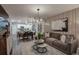 This bright living room connects to the open concept dining area and modern kitchen at 3763 King Hill Dr, Haines City, FL 33844