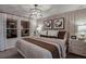 This spacious main bedroom is well-lit by natural light and features stylish modern decor at 3763 King Hill Dr, Haines City, FL 33844