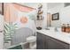 Trendy bathroom featuring an abstract curtain, vanity, and decorative wall shelves at 1741 Canaan Loop, Dundee, FL 33838
