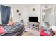 Bedroom featuring a cozy setup with a TV and ample natural light from the window at 1741 Canaan Loop, Dundee, FL 33838