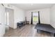 Room featuring neutral walls, hard floors, natural light, and a sleek black shelf at 1741 Canaan Loop, Dundee, FL 33838