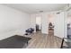 Open-concept room with hard floors, doors to bathroom and closet, and a bed frame at 1741 Canaan Loop, Dundee, FL 33838