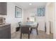 Bright breakfast nook adjacent to the kitchen, featuring modern decor and natural light at 1741 Canaan Loop, Dundee, FL 33838