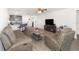 Comfortable living room featuring modern flooring, a neutral color palette, and open access to the kitchen at 1741 Canaan Loop, Dundee, FL 33838