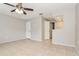 Bedroom featuring tiled floors, a ceiling fan, and natural light from the bright window at 248 Lake Thomas Dr, Winter Haven, FL 33880