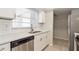 Kitchen featuring stainless steel appliances, white cabinetry and subway tile backsplash at 248 Lake Thomas Dr, Winter Haven, FL 33880