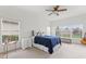 Bright bedroom with natural light, soft carpet, and a ceiling fan at 448 Sorrento Rd, Kissimmee, FL 34759