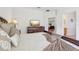 Comfortable bedroom with a brown headboard bed, side tables, and a dresser with a mounted television at 448 Sorrento Rd, Kissimmee, FL 34759