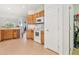Well-maintained kitchen area featuring tile flooring and a white appliance package at 448 Sorrento Rd, Kissimmee, FL 34759