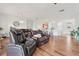 Open-concept living area with hardwood floors, and comfortable seating at 448 Sorrento Rd, Kissimmee, FL 34759