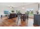 Spacious living and dining area with hardwood floors, neutral walls, and ample natural light at 448 Sorrento Rd, Kissimmee, FL 34759
