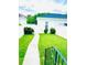 Clean backyard with a green lawn, white fence, and pathway, creating a serene outdoor space at 5489 Baldwin Park St, Orlando, FL 32814