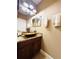 Stylish bathroom with a unique vessel sink, granite countertop, and dark wood cabinetry at 5489 Baldwin Park St, Orlando, FL 32814