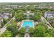 Overhead image of a community pool featuring lap lanes, lounge area, and meticulously landscaped surroundings at 5489 Baldwin Park St, Orlando, FL 32814
