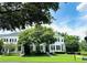 Inviting two-story home with lush landscaping, charming curb appeal, and well-manicured lawn at 5489 Baldwin Park St, Orlando, FL 32814