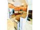 Spacious kitchen with stainless appliances, granite countertops, ample cabinet space, and tile flooring at 5489 Baldwin Park St, Orlando, FL 32814