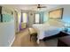 Light and airy main bedroom with a tufted headboard, ceiling fan, and carpet floors at 5489 Baldwin Park St, Orlando, FL 32814