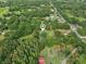 Aerial view of the property surrounded by lush greenery and neighborhood at 5525 Tillman Rd, Lakeland, FL 33810