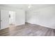 Bright bedroom featuring modern flooring, ensuite bathroom, and spacious closets for organized storage at 5525 Tillman Rd, Lakeland, FL 33810