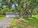 Charming single-story home with large tree and spacious front yard at 5525 Tillman Rd, Lakeland, FL 33810