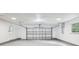 A spacious two-car garage featuring smooth floors and a garage door at 5525 Tillman Rd, Lakeland, FL 33810