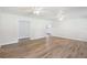 Spacious living room with wood-look floors leading into the kitchen at 5525 Tillman Rd, Lakeland, FL 33810