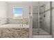 Bathroom features a soaking tub next to shower at 8875 Backspin Ln, Champions Gate, FL 33896