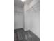 Walk-in closet featuring neutral carpet and wire shelving for ample storage at 8875 Backspin Ln, Champions Gate, FL 33896