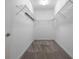 Walk-in closet with gray carpet and wire shelving, ready for storage at 8875 Backspin Ln, Champions Gate, FL 33896