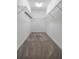 Walk-in closet featuring ample metal shelving, carpeting and neutral walls at 8875 Backspin Ln, Champions Gate, FL 33896