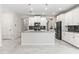 Bright kitchen with white cabinets, stainless steel appliances, and large island at 8875 Backspin Ln, Champions Gate, FL 33896