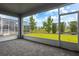 Enclosed patio features pavers, a view of the lawn, hedges and neighboring pool at 8875 Backspin Ln, Champions Gate, FL 33896
