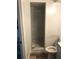 Bathroom featuring a tiled shower and a standard toilet and sink at 1257 Dal Maso Dr, Daytona Beach, FL 32117