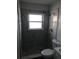 Bathroom features a shower, toilet, tile walls, and new fixtures at 1257 Dal Maso Dr, Daytona Beach, FL 32117