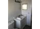 Bathroom with white vanity, toilet and new fixtures at 1257 Dal Maso Dr, Daytona Beach, FL 32117