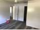 A bedroom features vinyl floors, ceiling fan and two doors at 1257 Dal Maso Dr, Daytona Beach, FL 32117
