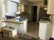 A bright kitchen featuring ample countertop space and classic white cabinetry at 1257 Dal Maso Dr, Daytona Beach, FL 32117