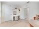 Bedroom featuring lighted vanity area, neutral carpet, walk-in closet, and modern design at 1335 Berry Ln, Davenport, FL 33837