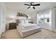 Cozy bedroom boasts a large bed, neutral tones, and a ceiling fan at 1335 Berry Ln, Davenport, FL 33837