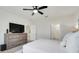 Airy bedroom with walk-in bathroom and flat screen television at 1335 Berry Ln, Davenport, FL 33837