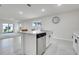 Bright, open-concept kitchen and living area with island seating at 1335 Berry Ln, Davenport, FL 33837