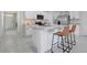 Modern kitchen with stainless steel appliances, island, and breakfast bar seating at 1335 Berry Ln, Davenport, FL 33837