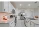 Bright kitchen featuring white cabinetry, stainless steel appliances, and stone countertops at 1335 Berry Ln, Davenport, FL 33837